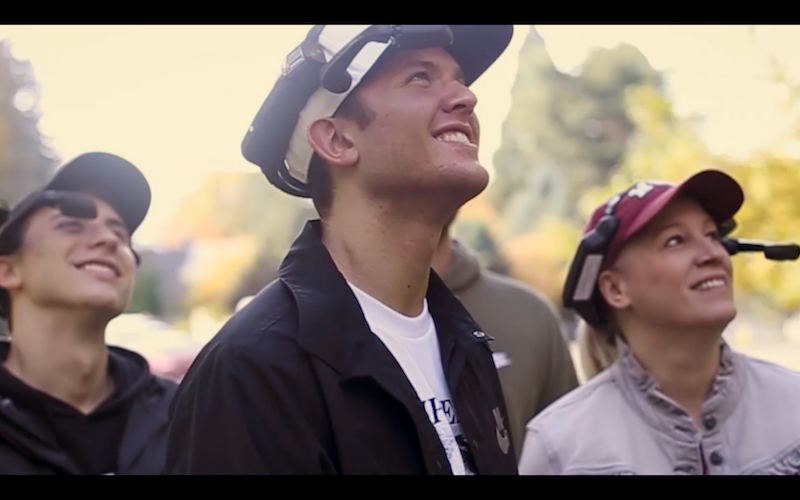 A photo from the trailer of the tour, including four people wearing RealWear headsets.